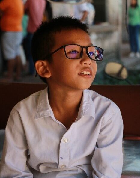Mr. Leng Bunchhay is looking far away.