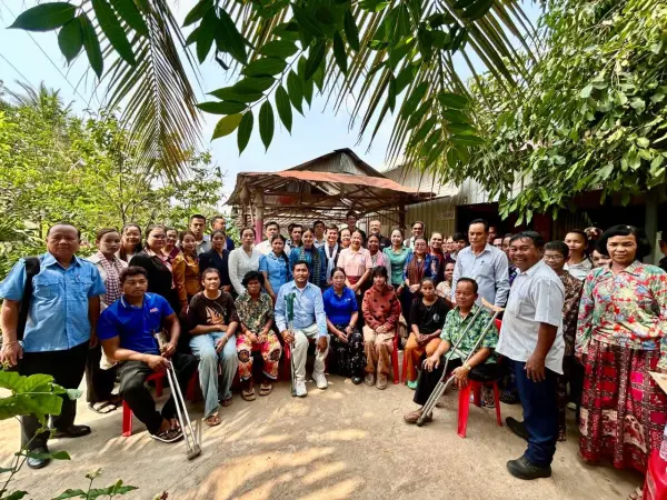 a large group of people posing for the camera.