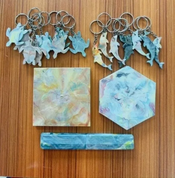 Key chains, rulers, and drink coaster made from recycled plastic.